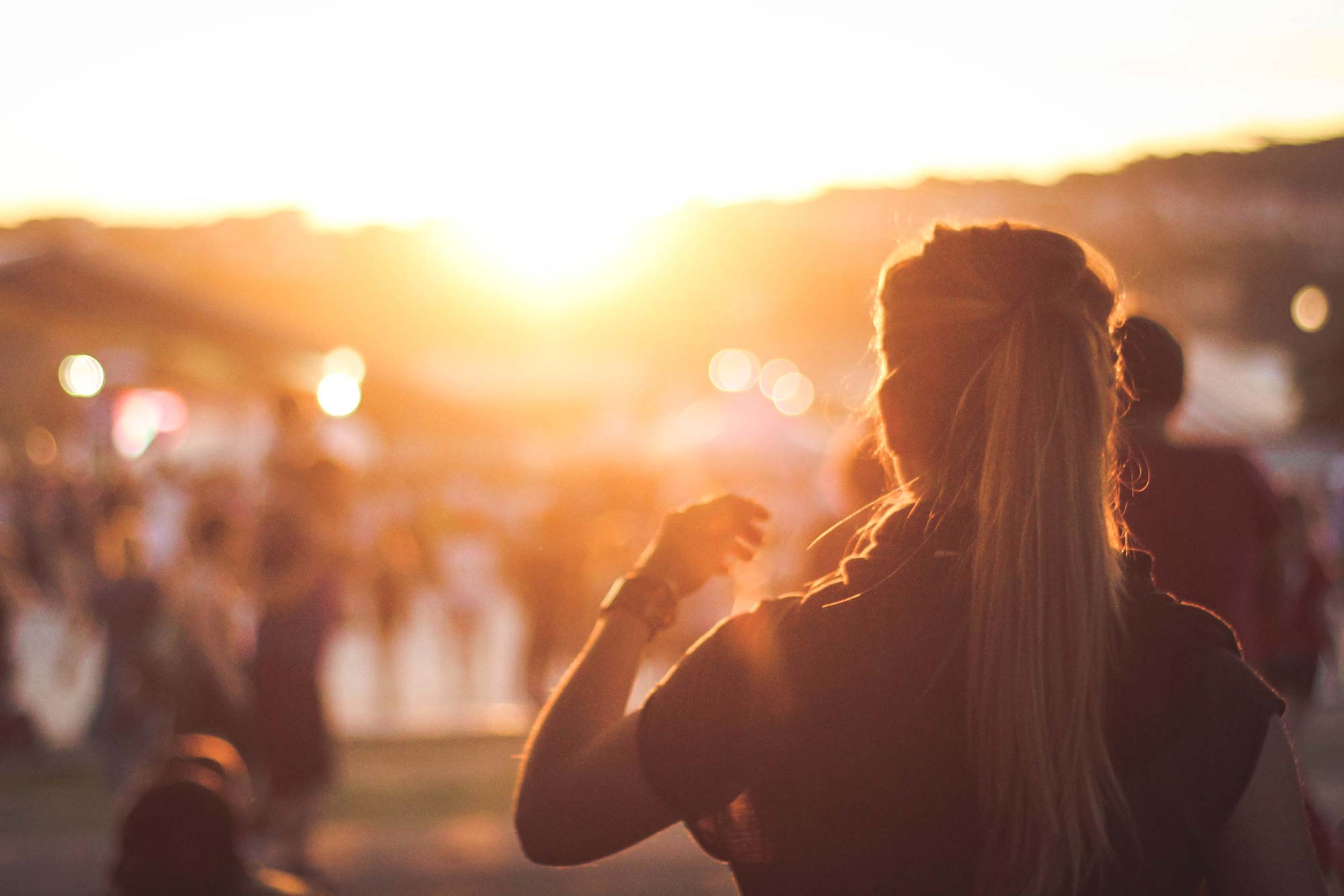 girl faces the setting sun